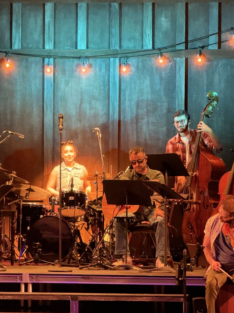 Jessie spotlit in performance of Ceilidh (KAY-lee)