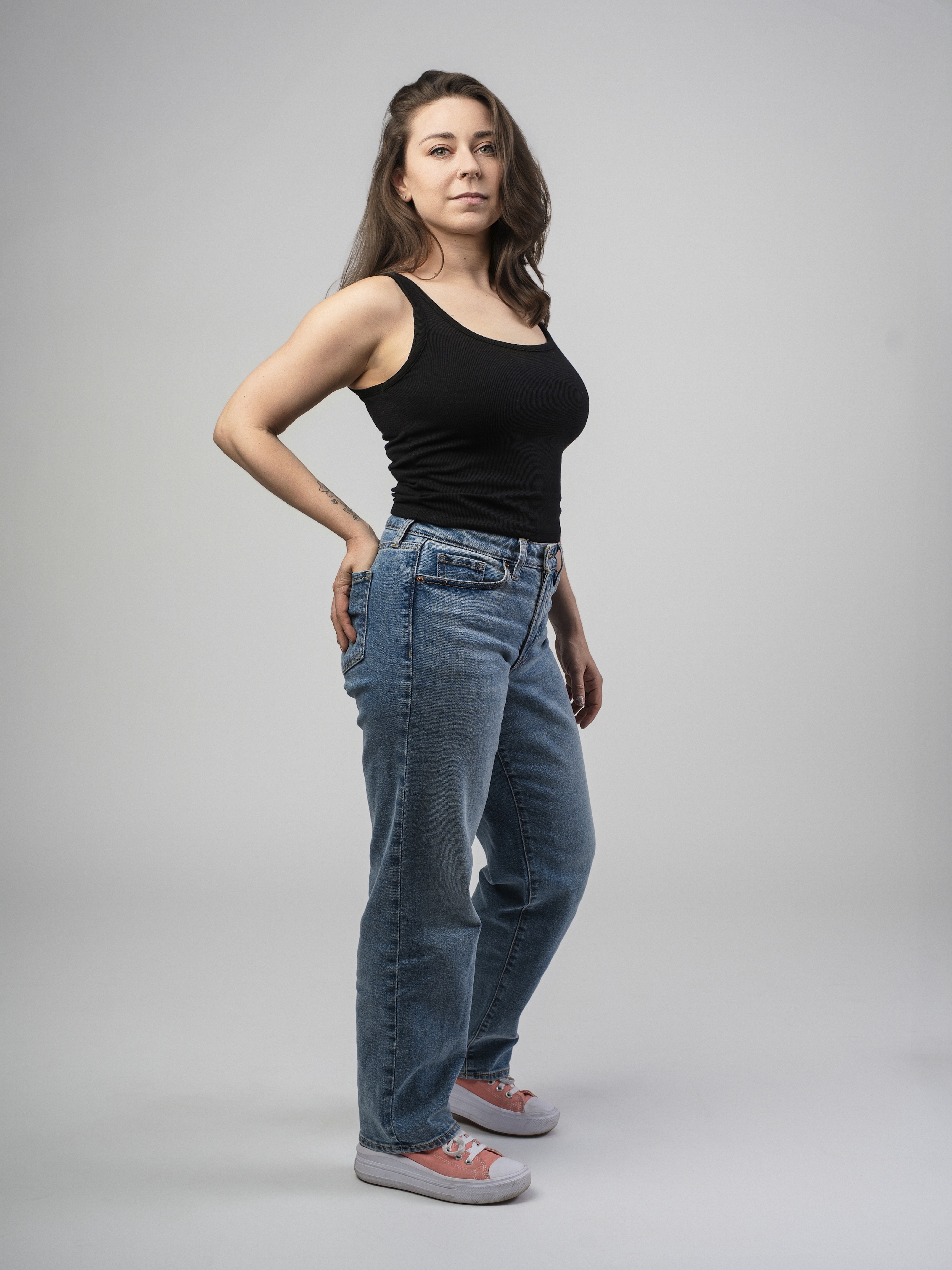 Jessie posing in front of percussion setup